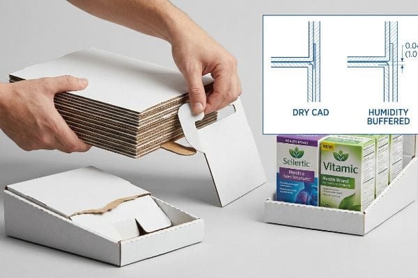 White corrugated cardboard box assembly, with a diagram comparing Dry Cad and Humidity Buffered slot clearance of 0.04 inches (1.0 mm).