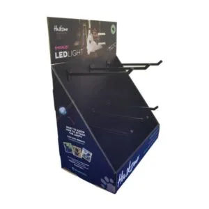 angled view of a blue custom cardboard peg hook display for led safety lights.