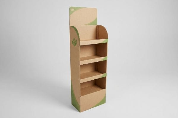 An eco-friendly cardboard sidekick display, crafted from unbleached kraft paperboard, features four shelves and green leaf motifs.