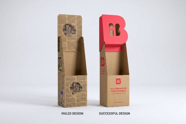 Cardboard floor displays: a Failed Design with dense text and a Successful Design featuring a red 3D die-cut 'B' header for brand messaging.