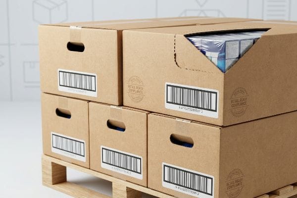 Brown corrugated cardboard retail ready packaging boxes with barcode labels, hand-holes, and 