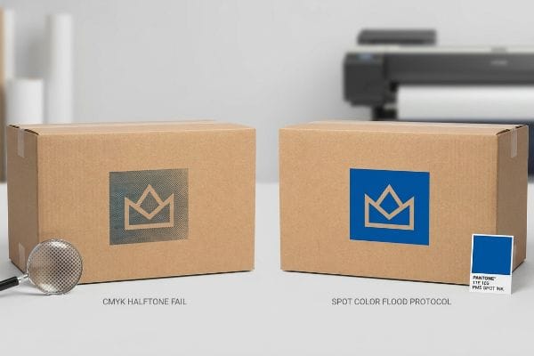 Brown corrugated cardboard boxes comparing CMYK Halftone Fail with Spot Color Flood Protocol. The left box shows a grainy logo, the right a vibrant blue logo with a Pantone 119 C5 PMS Spot Ink swatch.