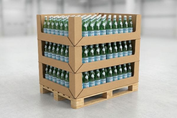 Three corrugated cardboard pallet displays stacked on a wooden pallet, filled with green glass San Pellegrino sparkling water bottles.