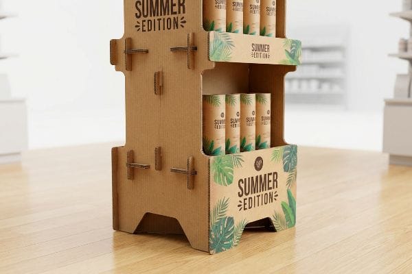 An event-driven corrugated cardboard POP display showcases 'Summer Edition' products with tropical leaf patterns in a retail aisle.