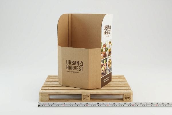 Urban Harvest POP Display Brown corrugated cardboard Urban Harvest floor POP display on a 48x40 GMA wooden pallet, showcasing food product images.