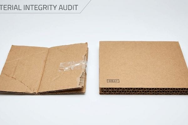 Cardboard Integrity Audit Damaged corrugated cardboard with clear tape beside a new 32ECT board, illustrating a Material Integrity Audit.