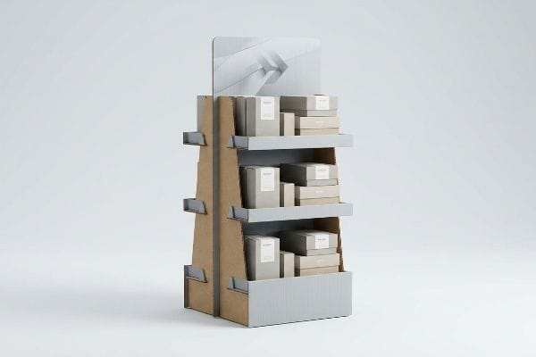 A corrugated cardboard point of purchase merchandiser features light gray shelves holding multiple beige and light gray product boxes.