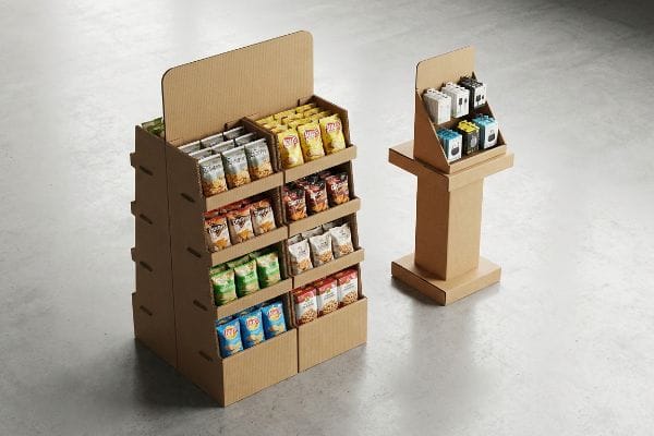 Two corrugated cardboard retail displays, featuring a multi-tiered POP floor fixture with Lay's snack bags and a smaller POS countertop unit.