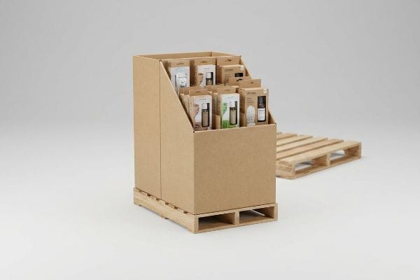 Corrugated quarter-pallet merchandiser with tiered shelves displaying AROMA and UPC products on a wooden shipping pallet.
