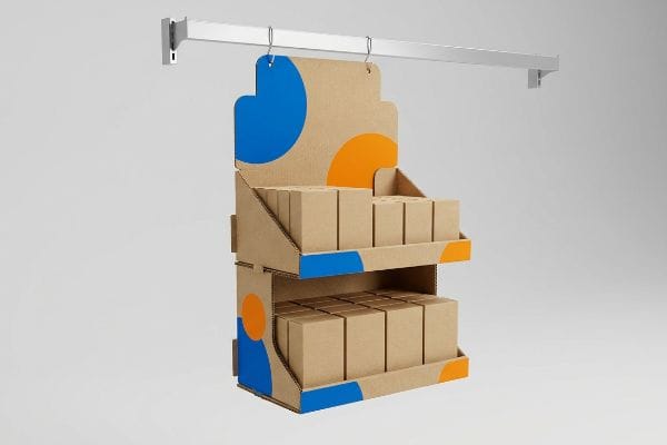 Two-Tier Sidekick Display Corrugated cardboard sidekick display, two-tier, hanging from a silver bar, with blue and orange spot color graphics and small brown product boxes.