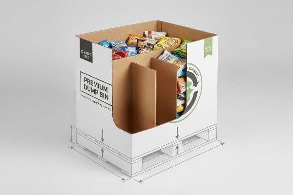 Corrugated premium dump bin display with internal dividers, filled with assorted snacks, showing 'Premium Dump Bin' text and pallet design.