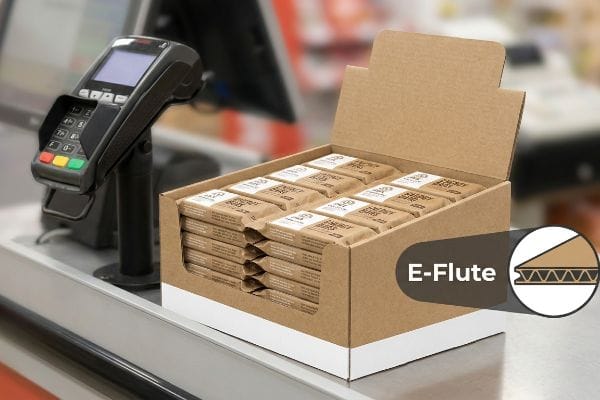 E-Flute corrugated countertop merchandiser displaying Energy Bars at a point of sale, next to a payment terminal.