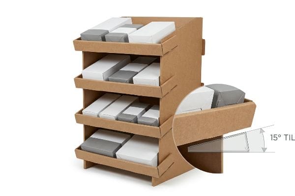 Kraft corrugated gravity flow rack with four tilted shelves displaying white and gray boxes, highlighting the 15-degree tilt.