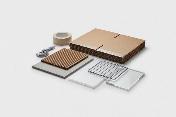 POSM Materials Assortment A micrometer, corrugated board, rigid chipboard, fluted polypropylene, wire racks, acrylic sheets, and flat-pack displays.