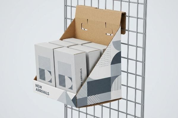 Corrugated power wing display with geometric grey pattern, featuring 'New Arrivals' text, holding white product boxes on a metal grid.