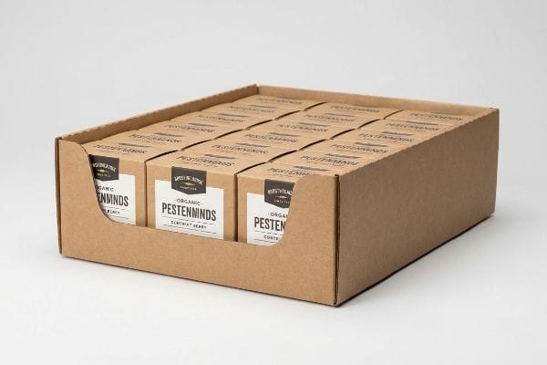 Brown corrugated cardboard PDQ tray filled with Organic Pestenninds Contriat Berry boxes, featuring a front die-cut swoop for product visibility.