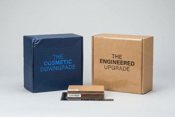 Virgin 32 ECT Kraft corrugated samples and a ruler, flanked by a blue box 'The Cosmetic Downgrade' and a brown box 'The Engineered Upgrade', comparing packaging strength.