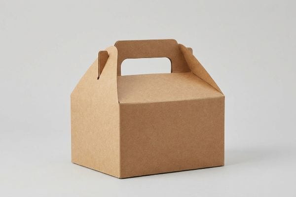 Brown Kraft Gable Box Brown kraft paper gable box with integrated carrying handle for portable packaging.