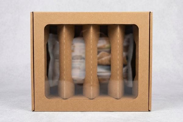 Brown kraft cardboard box with a clear window and three vertical support columns, demonstrating shop-through retail packaging.