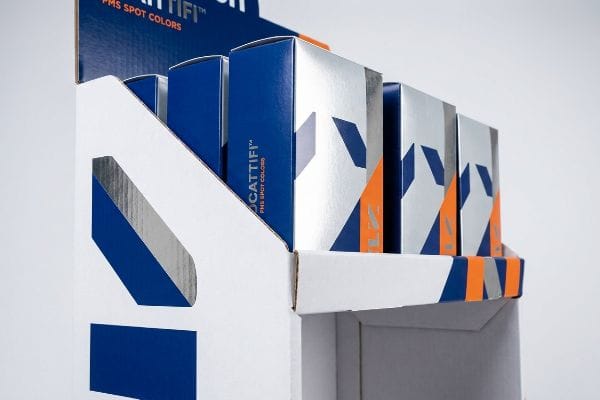 Cattifi Retail Display Boxes A corrugated retail display box showcases Cattifi product boxes in silver, blue, and orange, highlighting PMS Spot Colors.
