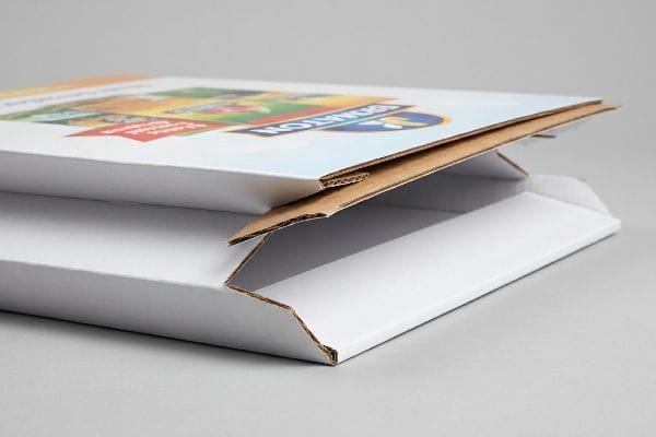 White corrugated mailer box partially open, revealing brown flute and a litho-laminated lid with 'Donation' graphic.