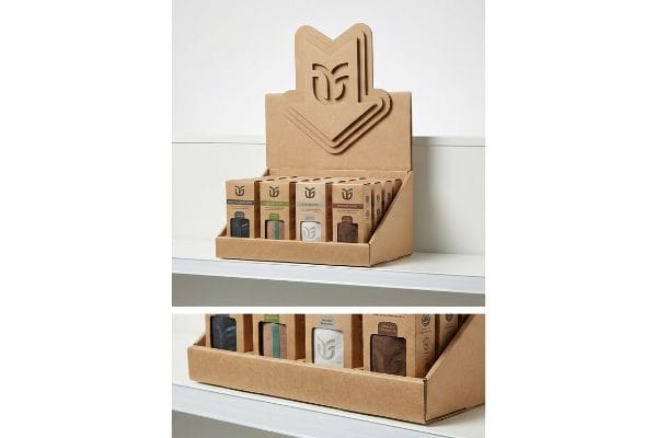 Cardboard Retail Display Brown corrugated cardboard POP display with a die-cut DF logo header, featuring Activated Charcoal Soap, Lemongrass, Unscented, and Exfoliating products for retail visibility.