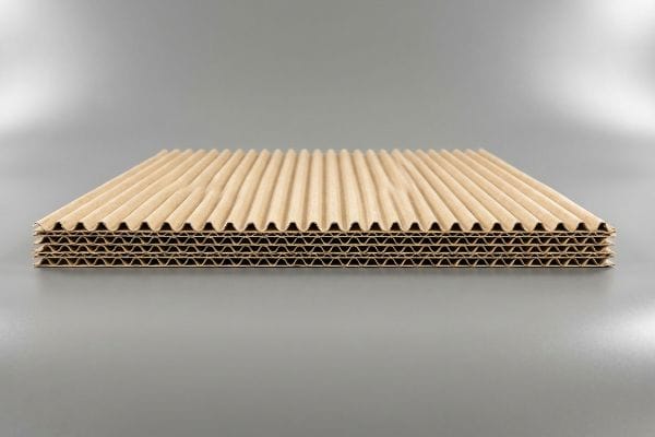 Corrugated Fluting Layers Natural brown corrugated cardboard layers showcasing a multi-wall fluting structure for packaging strength.