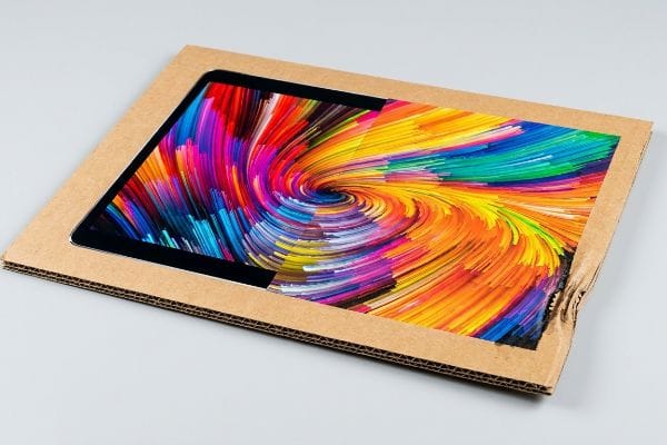 Vibrant Corrugated Display Brown corrugated cardboard display header with a vibrant, swirling RGB color artwork cutout, showcasing potential ink saturation.