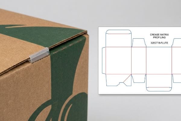 Corrugated box with dark green print and plastic clip, shown with a dieline for Crease Matrix Profiling 32ECT B-Flute.