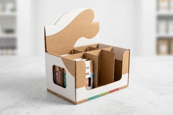 Custom Cardboard Display Box A custom cardboard display box with internal dividers, featuring kraft paper and white graphic printing, designed for retail product visibility.