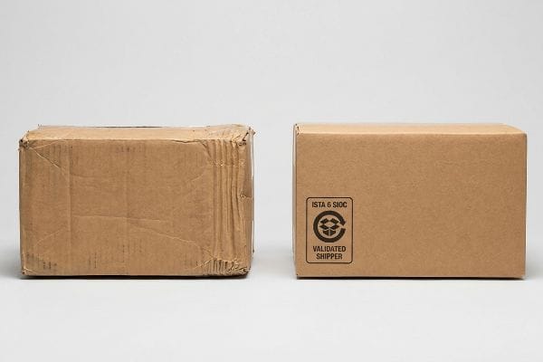 Damaged vs New Boxes Damaged and new brown corrugated boxes, the new one featuring an ISTA 6 SIOC Validated Shipper stamp.
