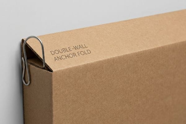 Double-Wall Anchor Fold Brown corrugated cardboard box showing a metal S-clip securely engaging the Double-Wall Anchor Fold.