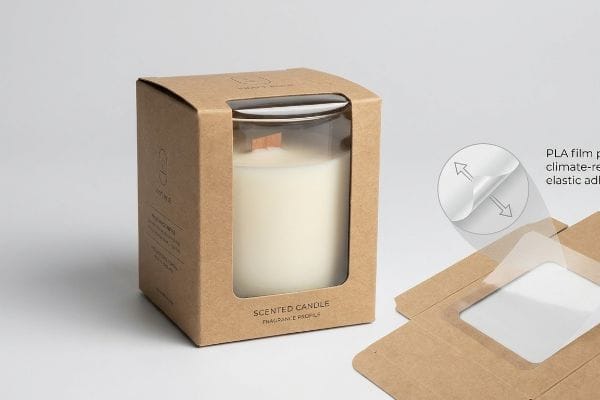 Brown kraft box with a 'Scented Candle' in a glass jar, featuring a flexible PLA film window patch and climate-resistant elastic adhesive.