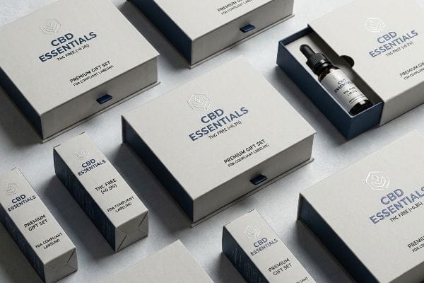 article-image Bright retail lighting illuminates a minimalist white CBD gift box with embossed labels sitting on a clean wooden display shelf.