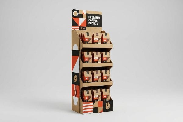 Premium Coffee Display Showcasing Premium Coffee Blends, this corrugated cardboard POP display features a geometric design and four shelves of brown coffee bags.
