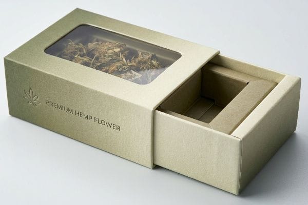 Premium Hemp Box Display A partially open rigid box for Premium Hemp Flower, featuring a clear window displaying dried botanical material and an empty pull-out drawer.