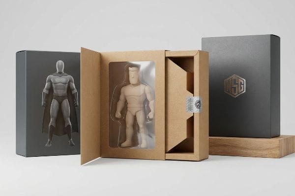 Action Figure Packaging Display Three action figure packaging boxes: dark grey with superhero art, open kraft box with unpainted figure and holographic seal, and dark grey with Gold LSG logo.