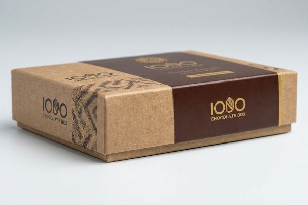 Premium Iono Chocolate Box Textured Kraft paperboard base and dark brown lid Iono Chocolate Box, featuring gold foil 'Iono Chocolate Box' branding and a subtle patterned design.