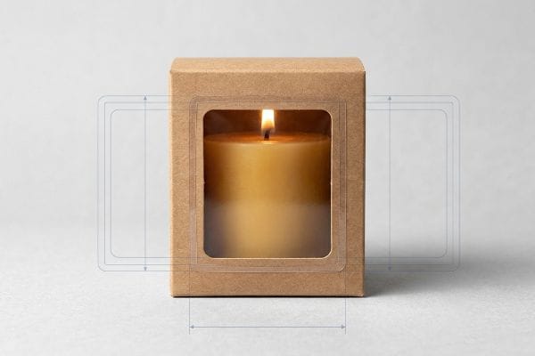 Candle Kraft Window Box A lit beeswax candle glows inside a custom kraft paperboard box featuring a clear window patch, showcasing the product.