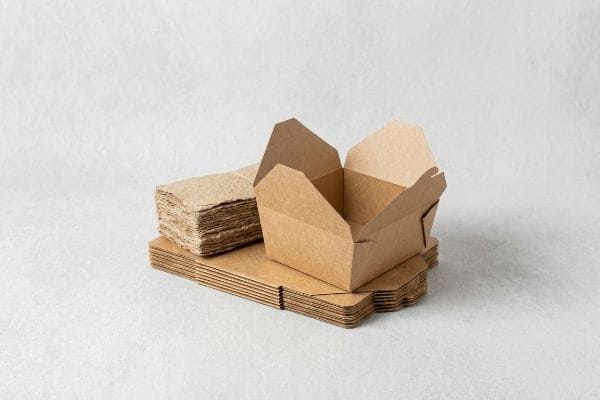 An open brown foldable carton and flat-pack paperboard boxes, showcasing curbside repulpable OCC packaging solutions.