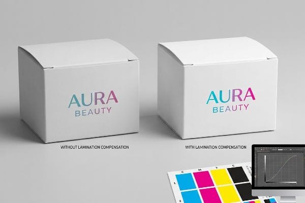 Lamination Color Compensation Two white Aura Beauty boxes, one labeled 'Without Lamination Compensation' with muted colors, the other 'With Lamination Compensation' showing vibrant, accurate colors.