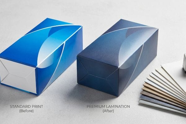 Lamination Optical Darkening Effect Two blue packaging boxes, Standard Print (Before) and Premium Lamination (After), illustrating the optical darkening effect of soft touch film.