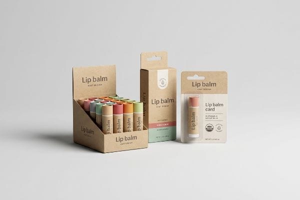 Lip Balm Packaging Styles Eco-friendly Lip Balm packaging, including a kraft countertop PDQ display of colorful tubes, a retail box, and a blister card with USDA Organic Lip Balm.