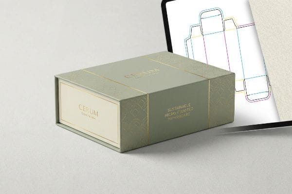 Cerum Cosmetic Box Design A luxury Cerum cosmetic box, sustainable micro-fluted paperboard, gold foil accents, beside a tablet with a die-cut template.