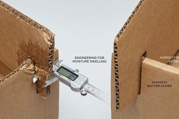 Packaging Moisture Engineering A digital caliper measures corrugated board thickness at 1.01 mm, highlighting 'Engineering For Moisture Swelling' and 'Humidity Buffer Added' for packaging slots.