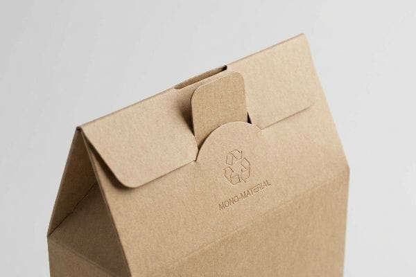 Mono-Material Packaging Closure Brown kraft paperboard packaging with an embossed recycling symbol and 'Mono-Material' text, showcasing an origami-style friction lock closure.