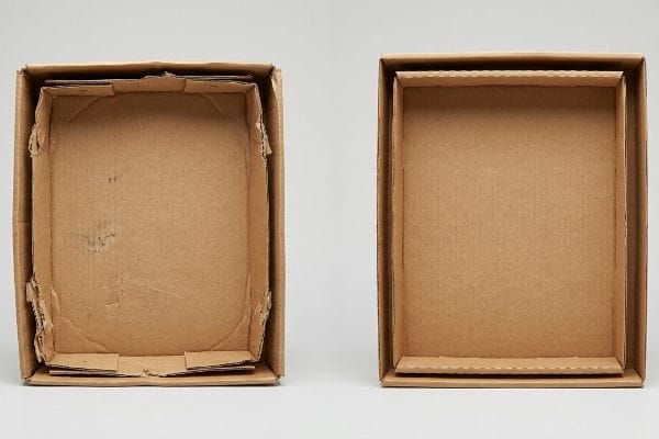Brown corrugated cardboard boxes illustrating tight nested packaging versus a proper offset tolerance with perimeter clearance buffer.