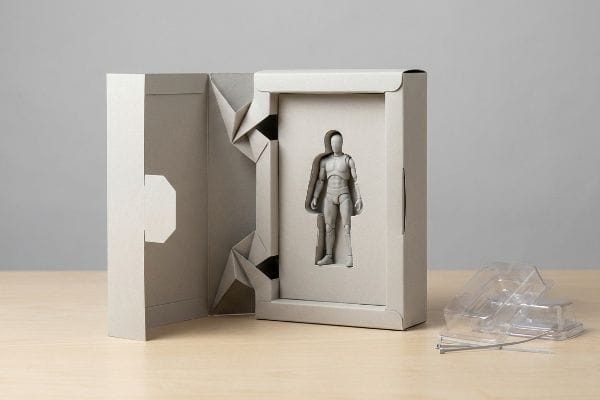 Origami Action Figure Packaging Gray paperboard action figure packaging with origami-style paper locks, replacing discarded plastic blister and wire ties.