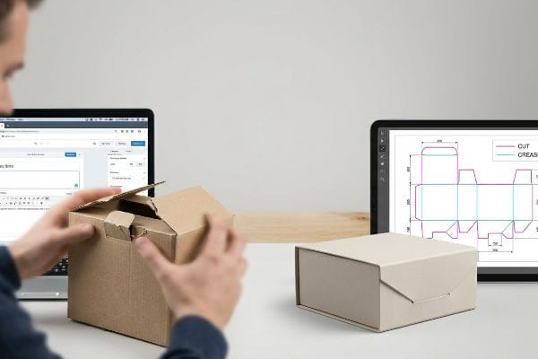 Packaging Design Die-Line Hands assembling a brown cardboard box, beside a tablet displaying a packaging die-line with Cut and Crease lines.