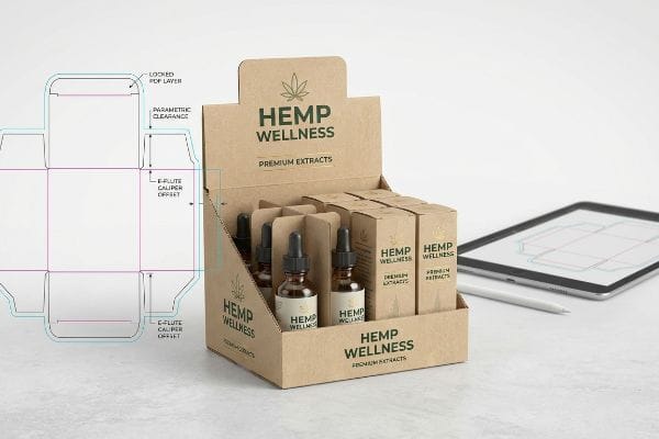 Parametric Clearance and E-Flute Caliper Offset dieline, beside a kraft Hemp Wellness display.